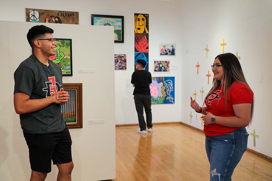 Two students talking inside Steppling Art Gallery