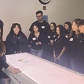 Students gathered around anatomage table