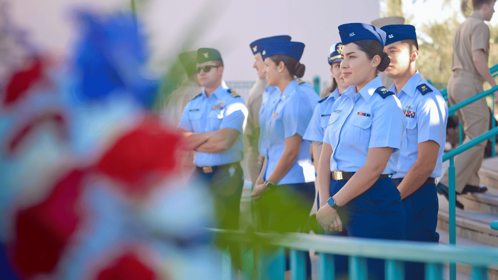 Students in blue military uniforms standing next to each other.